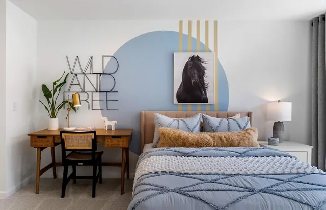 a bedroom with a bed and a chair