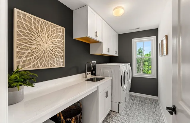 a kitchen with kitchen island a stove a sink and a refrigerator