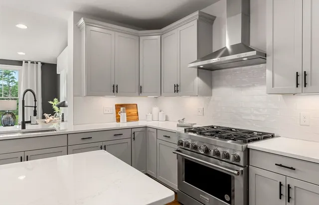 a kitchen with cabinets and appliances
