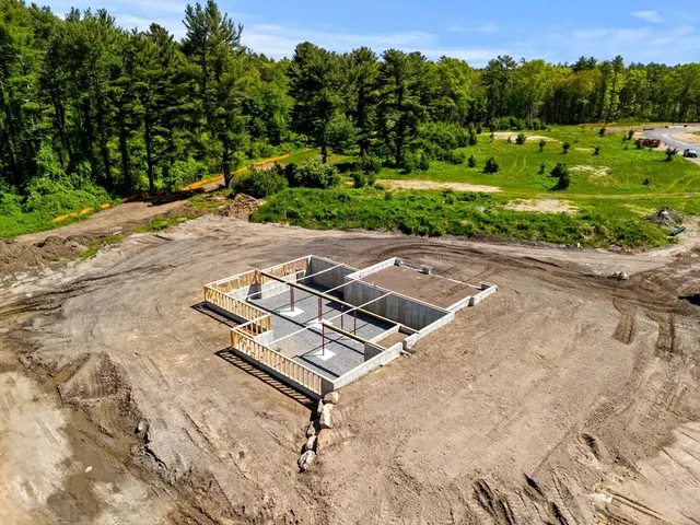 an aerial view of a backyard with mountain view