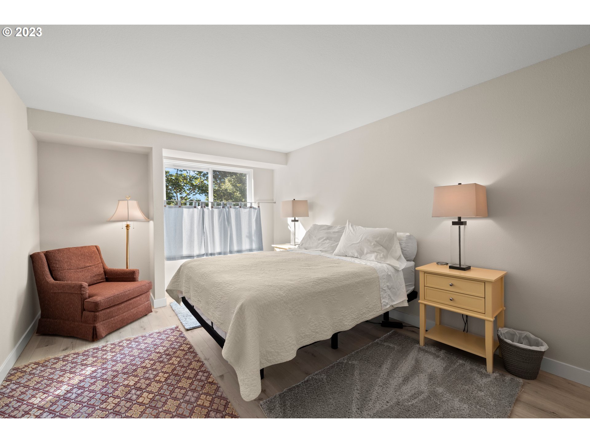 8720 Southwest Tualatin Road, Unit 321 Tualatin, OR 97062 - Photo 12 of 21 a bedroom with a bed and a couch