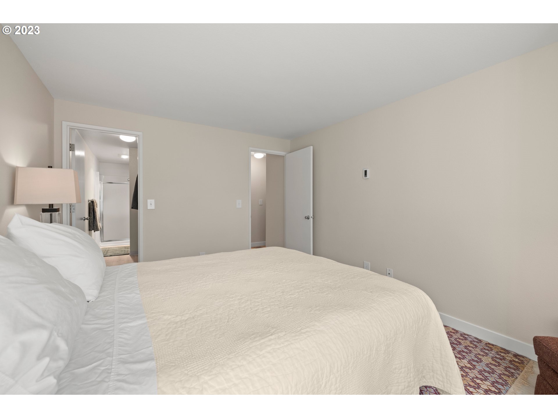 8720 Southwest Tualatin Road, Unit 321 Tualatin, OR 97062 - Photo 13 of 21 a large white bed in a white room