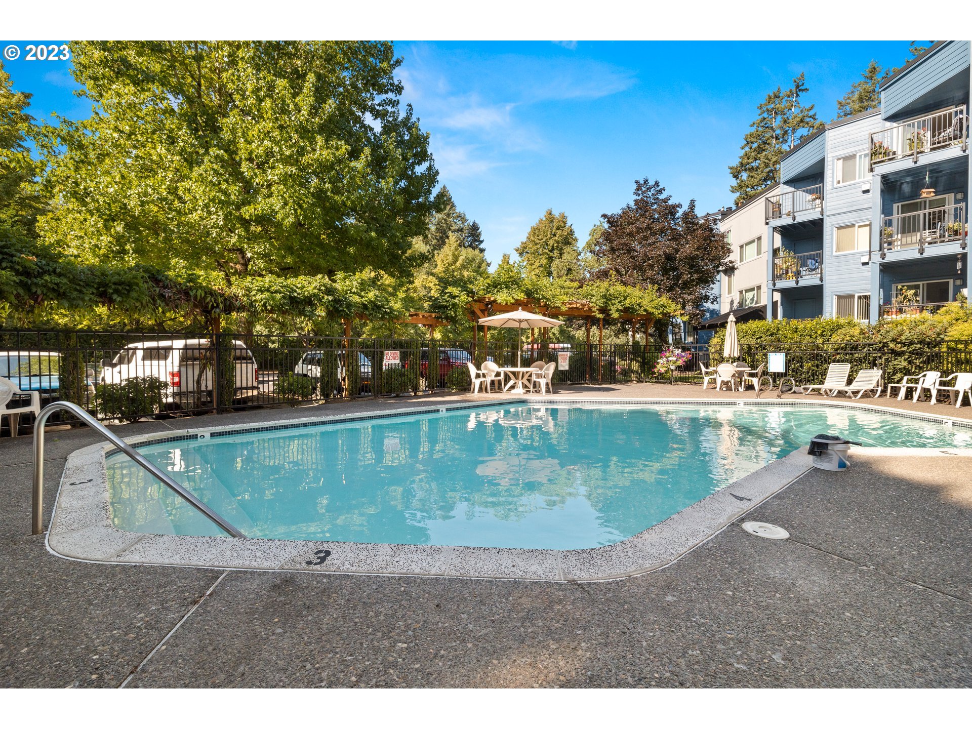 8720 Southwest Tualatin Road, Unit 321 Tualatin, OR 97062 - Photo 21 of 21 a view of a swimming pool with a yard