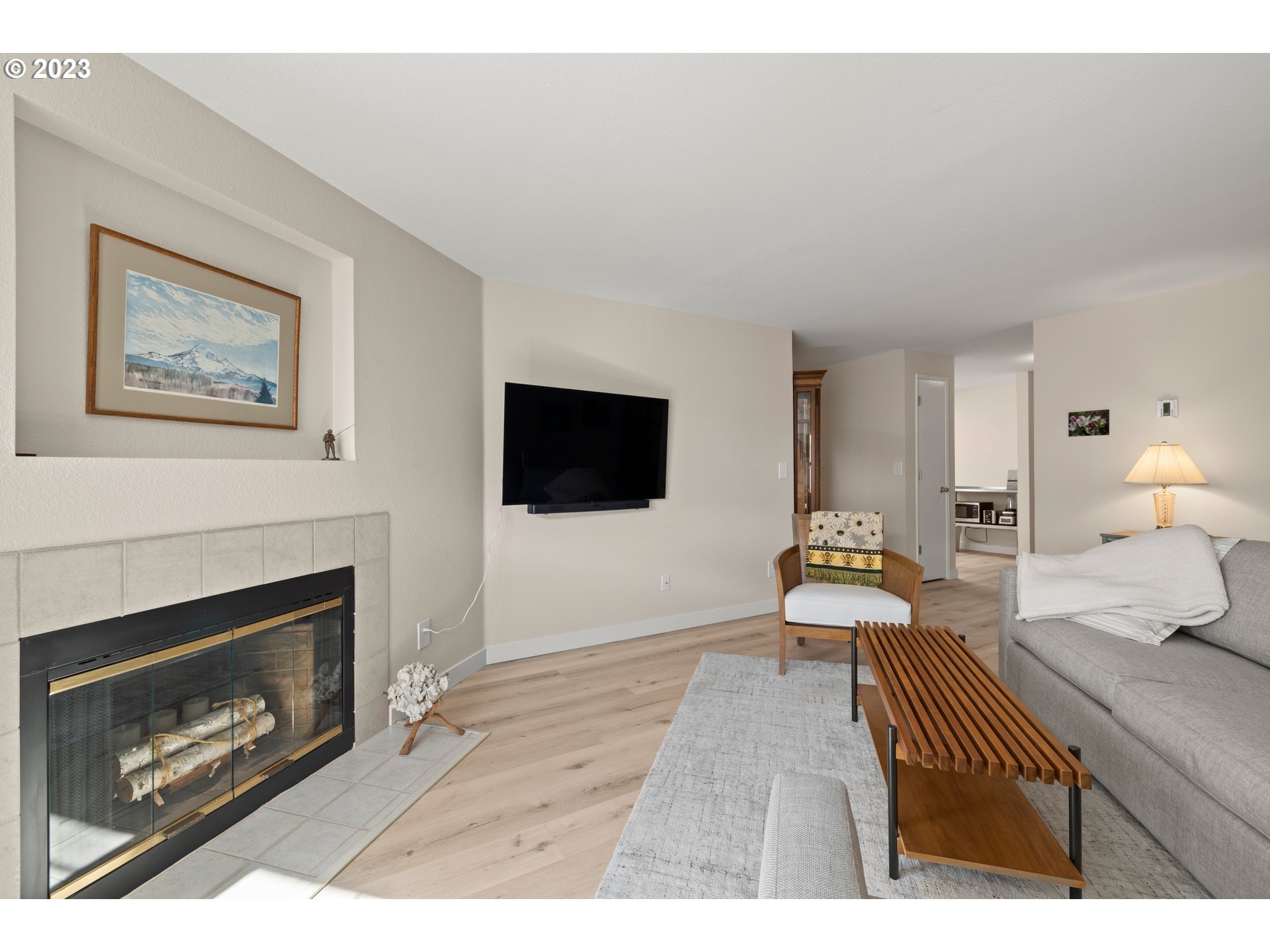 8720 Southwest Tualatin Road, Unit 321 Tualatin, OR 97062 - Photo 3 of 21 a living room with furniture and a fireplace