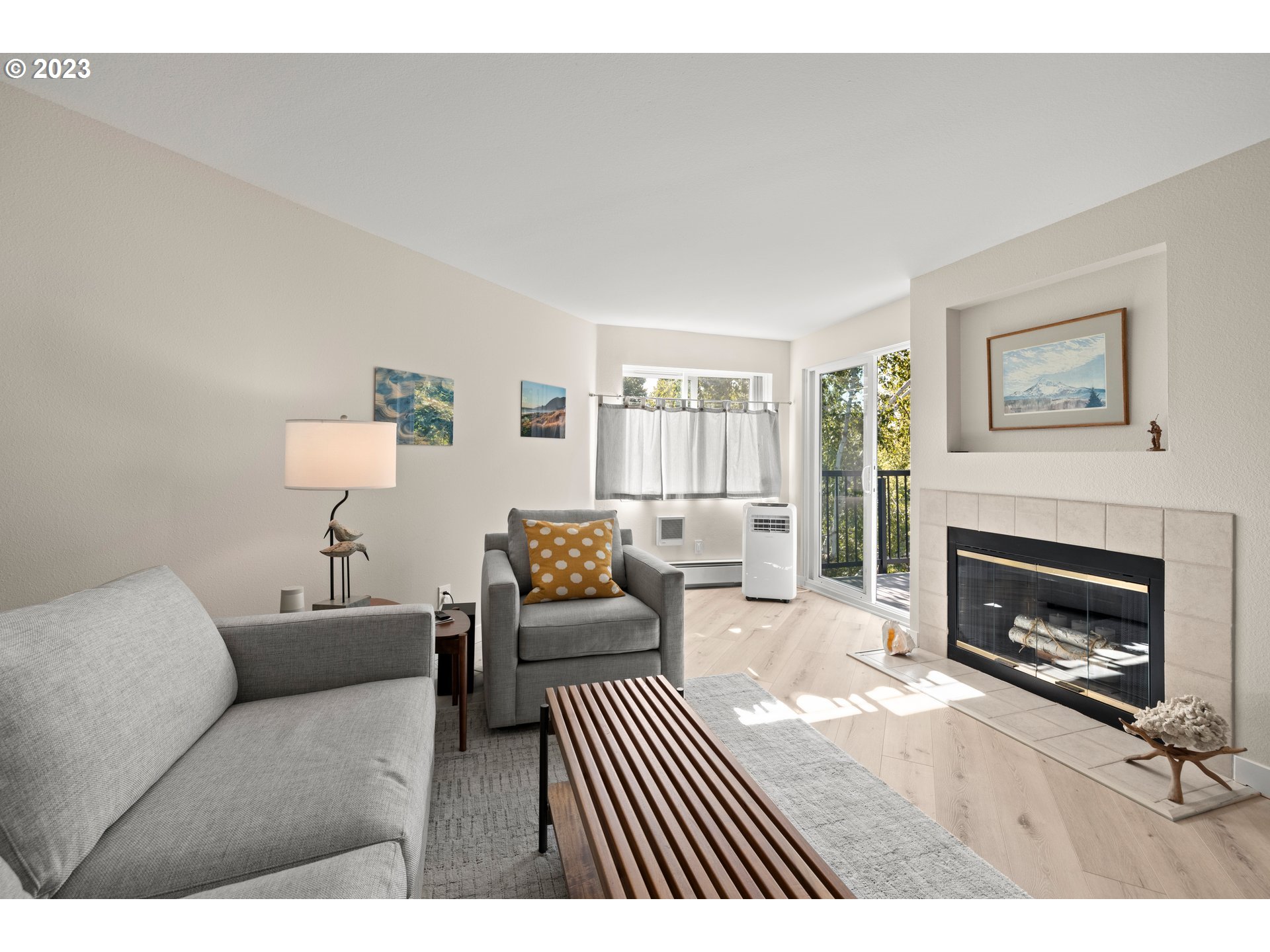 8720 Southwest Tualatin Road, Unit 321 Tualatin, OR 97062 - Photo 5 of 21 a living room with furniture and a fireplace