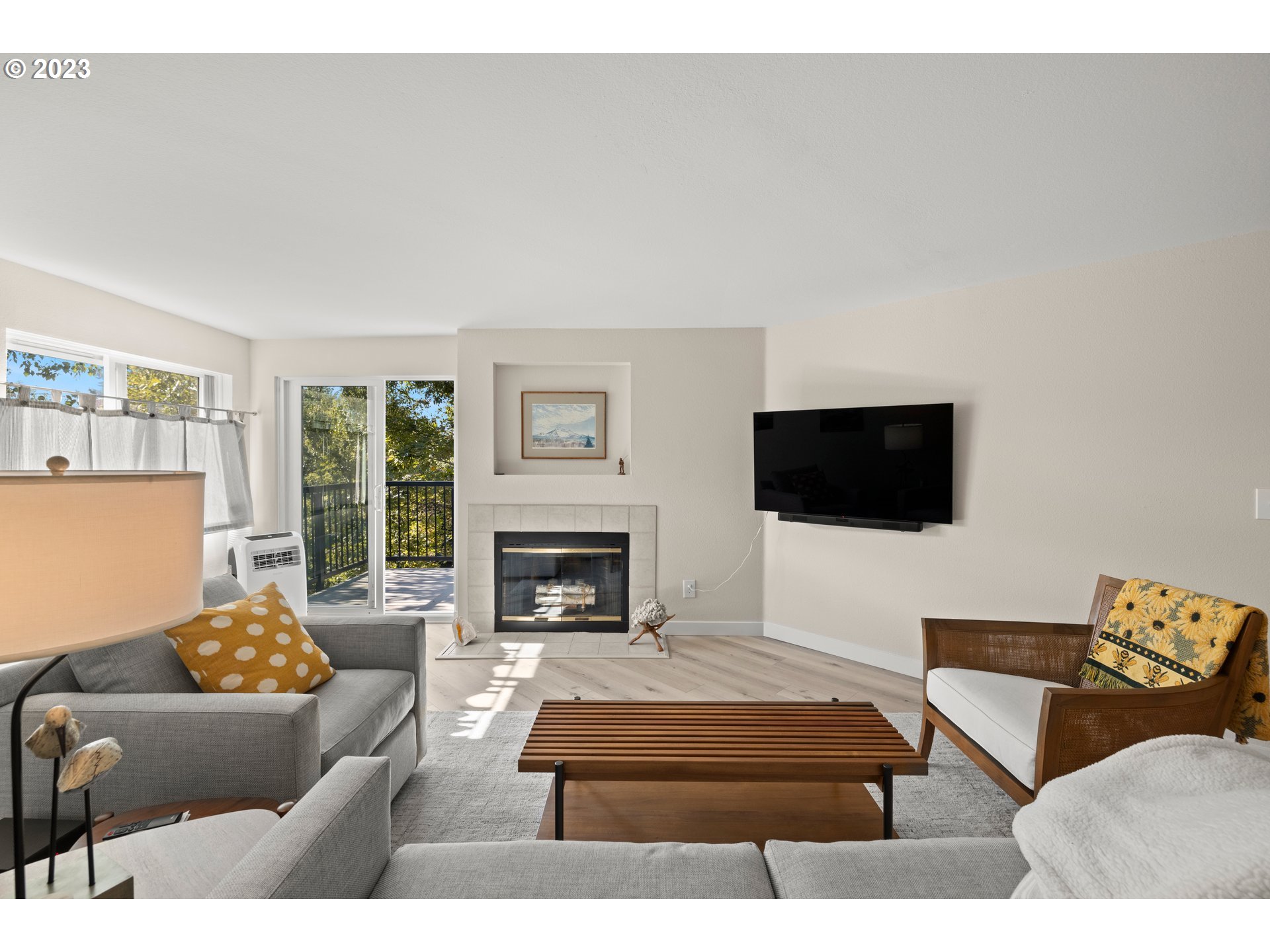 8720 Southwest Tualatin Road, Unit 321 Tualatin, OR 97062 - Photo 6 of 21 a living room with furniture and a flat screen tv