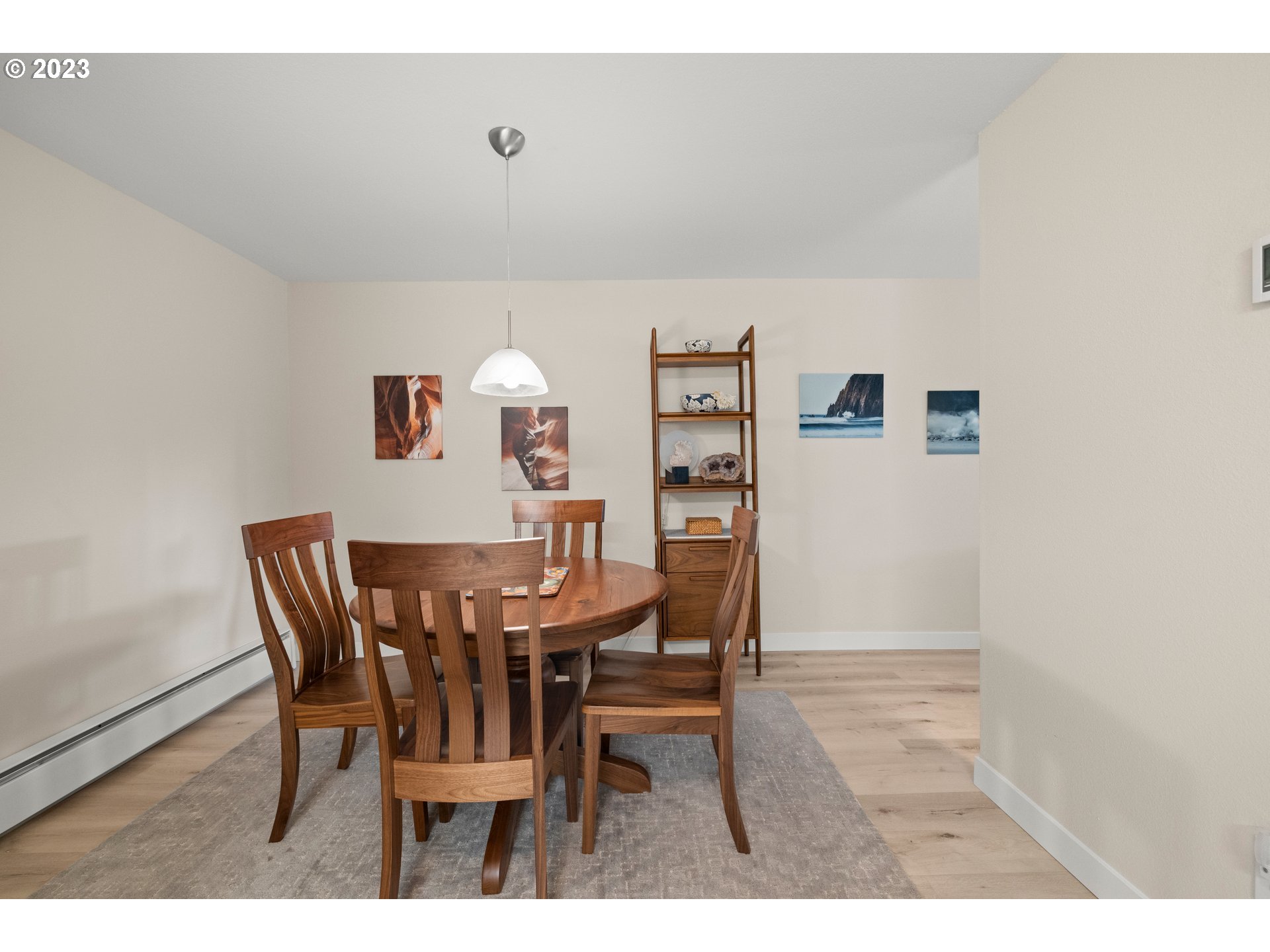 8720 Southwest Tualatin Road, Unit 321 Tualatin, OR 97062 - Photo 9 of 21 a view of a dining room with furniture and wooden floor