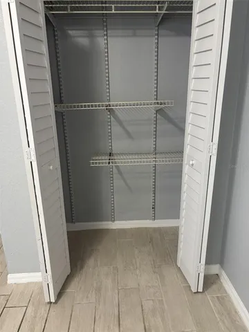 a bathroom with a glass door shower