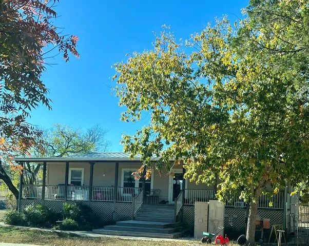 an outdoor view of house with yard