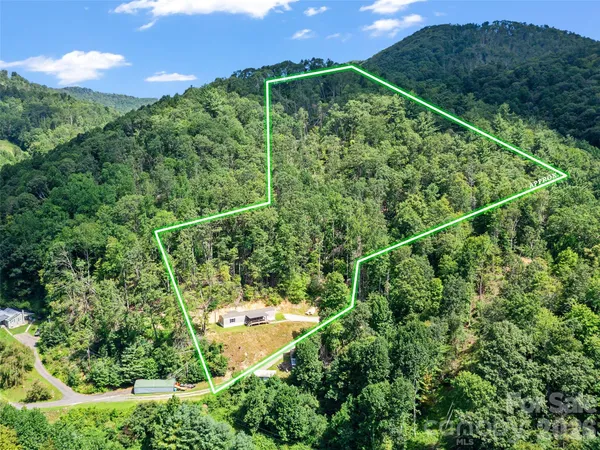 a view of a yard from a balcony