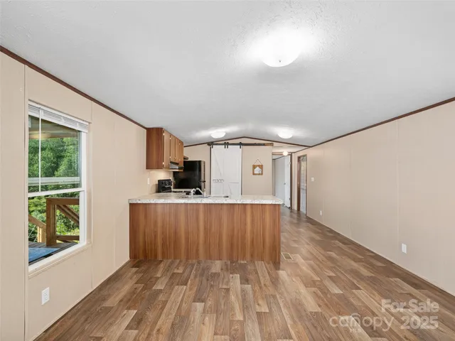 a kitchen with a refrigerator sink and stove