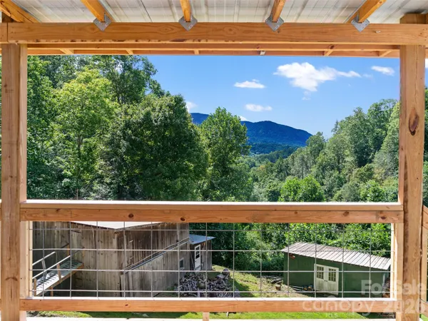 a view of a kitchen with a sink and a window