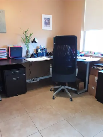 a workspace with furniture and window