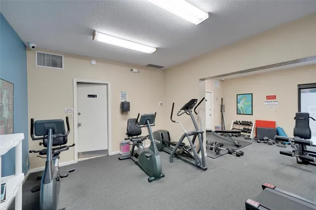 a view of a room with gym equipment