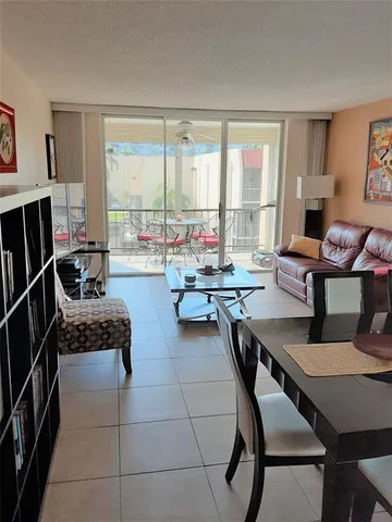 a work room with furniture and a large window