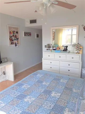 a room with a bed and a mirror