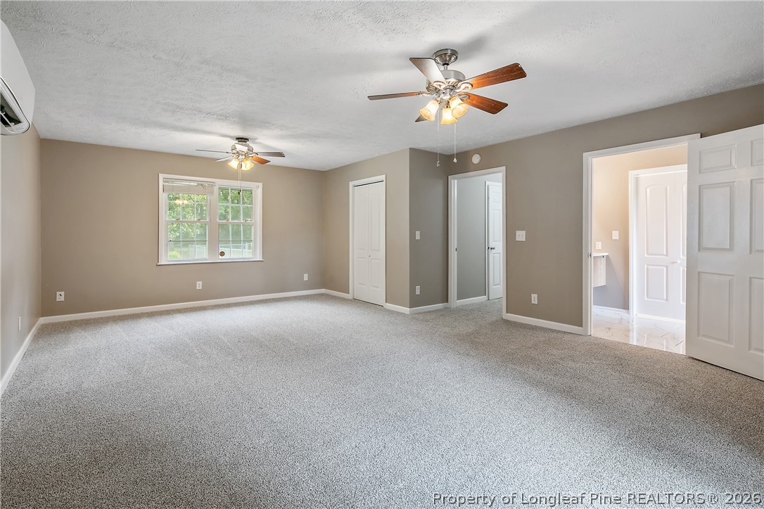 6062 Midus Street Hope Mills, NC 28348 - Photo 17 of 49 a view of a livingroom with a ceiling fan and window