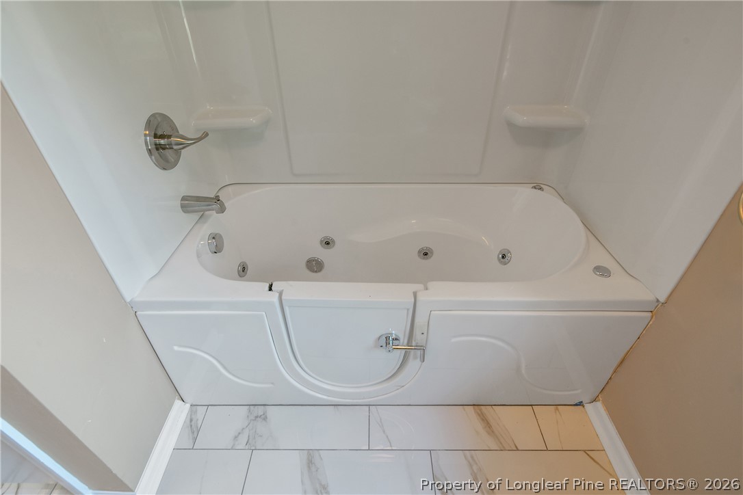 6062 Midus Street Hope Mills, NC 28348 - Photo 20 of 49 a bathroom with a bathtub