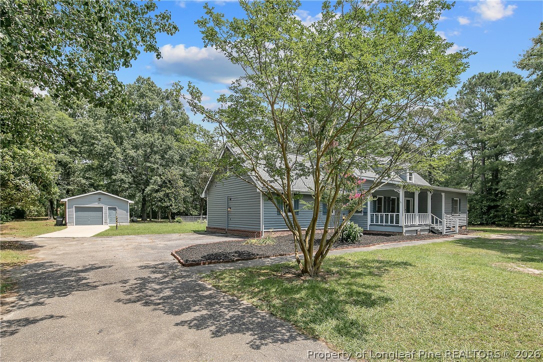 6062 Midus Street Hope Mills, NC 28348 - Photo 3 of 49 a front view of a house with a yard