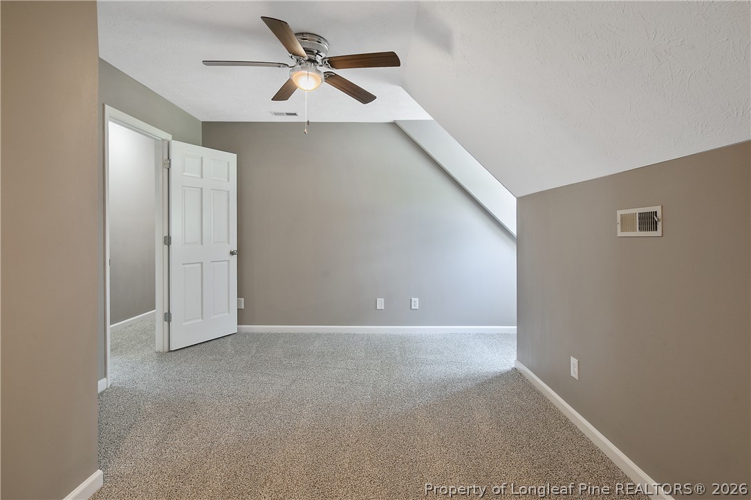 6062 Midus Street Hope Mills, NC 28348 - Photo 40 of 49 a view of a big room with closet and ceiling fan