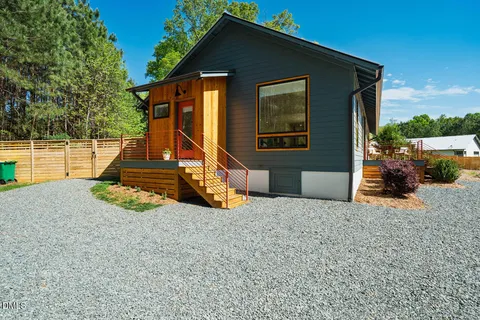 a view of backyard with a slide