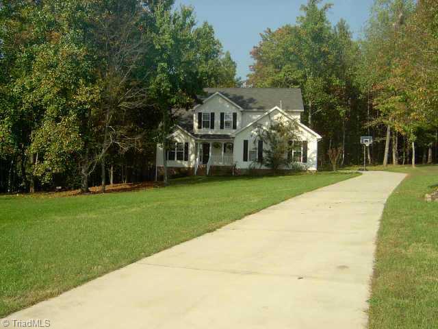 7915 McCreedy Drive Oak Ridge, NC 27310 - Photo 2 of 9 Other. Long drive shows how large and private the lot is.