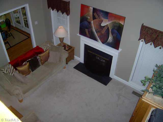 7915 McCreedy Drive Oak Ridge, NC 27310 - Photo 6 of 9 Other. Den with gas log fireplace.