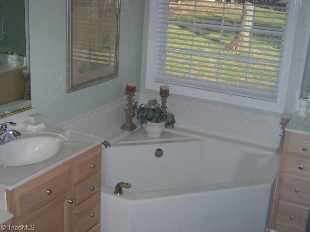 7915 McCreedy Drive Oak Ridge, NC 27310 - Photo 8 of 9 Other. Nice luxury bath tub and separate shower in Master bath.