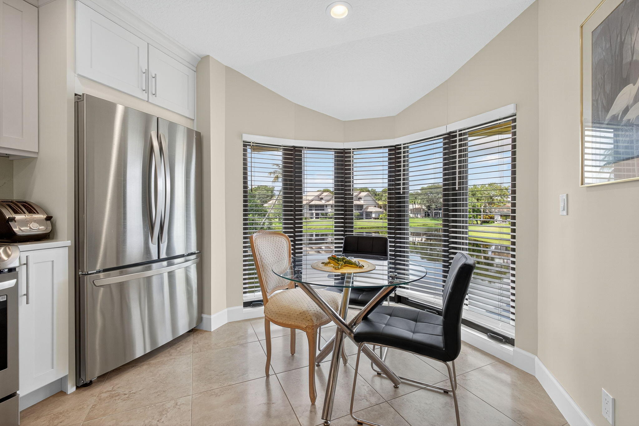16941 Waterbend Drive, Unit 252 Jupiter, FL 33477 - Photo 15 of 34 a view of a livingroom with furniture and a large window
