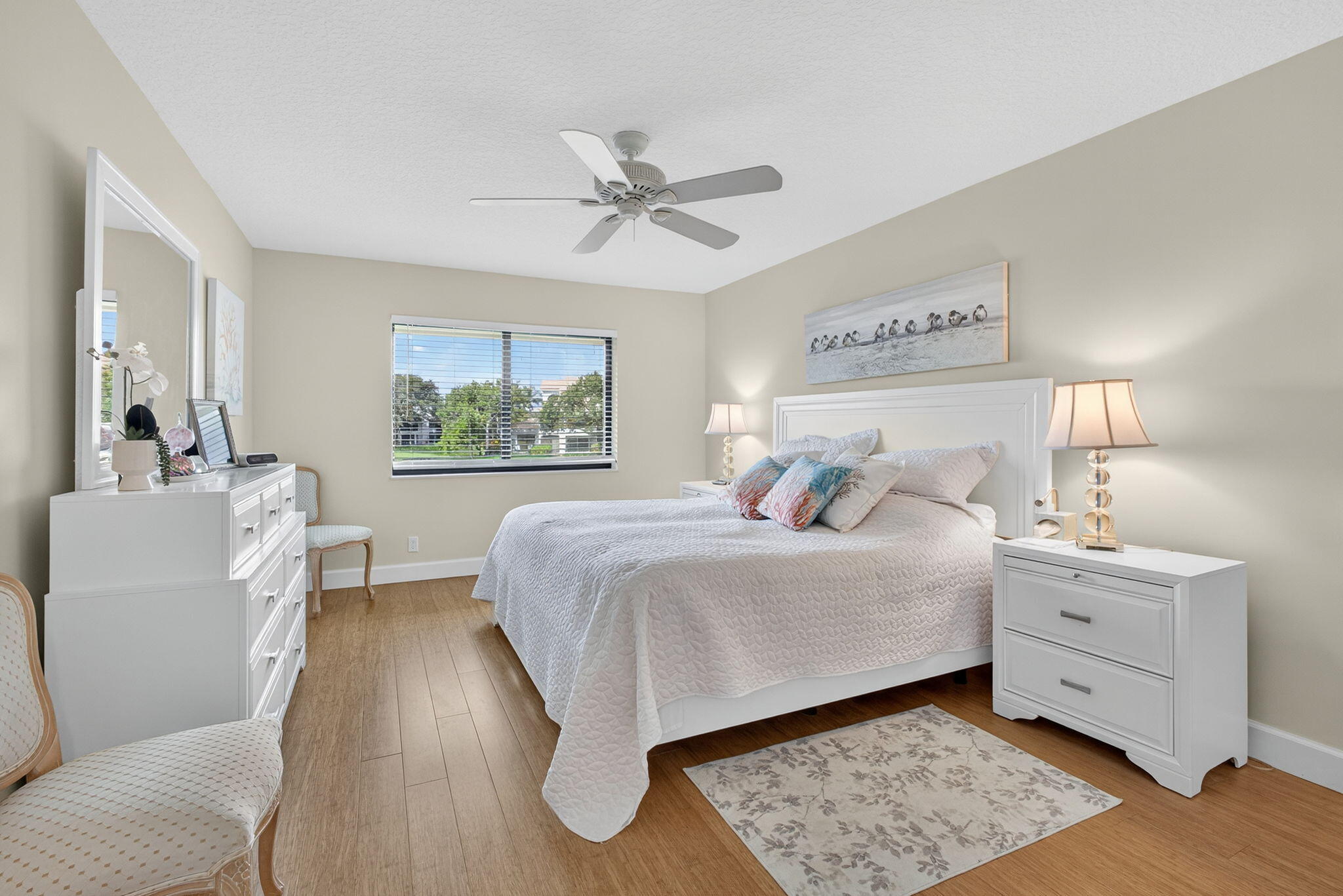 16941 Waterbend Drive, Unit 252 Jupiter, FL 33477 - Photo 25 of 34 a bedroom with a bed and a chandelier