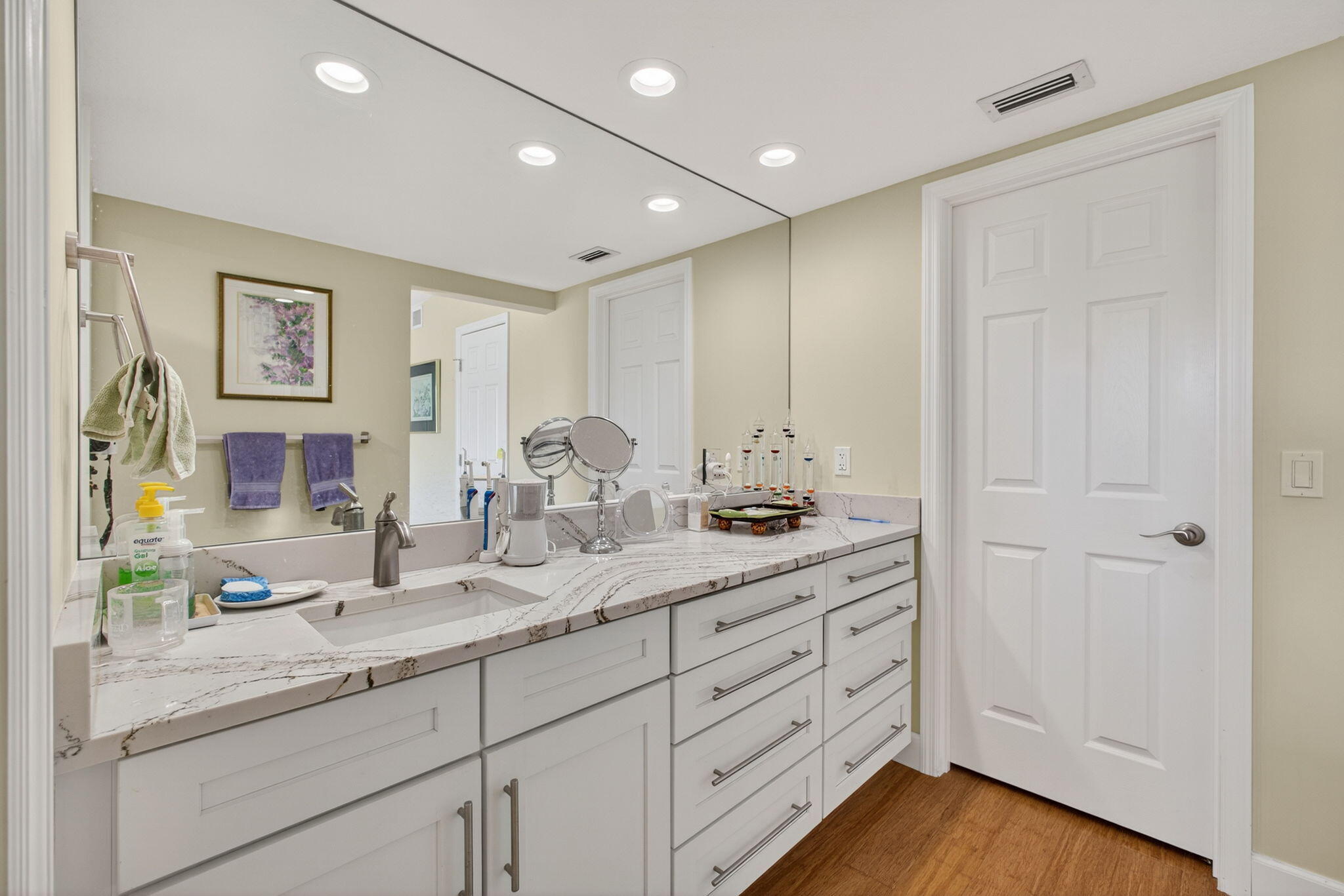 16941 Waterbend Drive, Unit 252 Jupiter, FL 33477 - Photo 27 of 34 a bathroom with a double vanity sink and a mirror