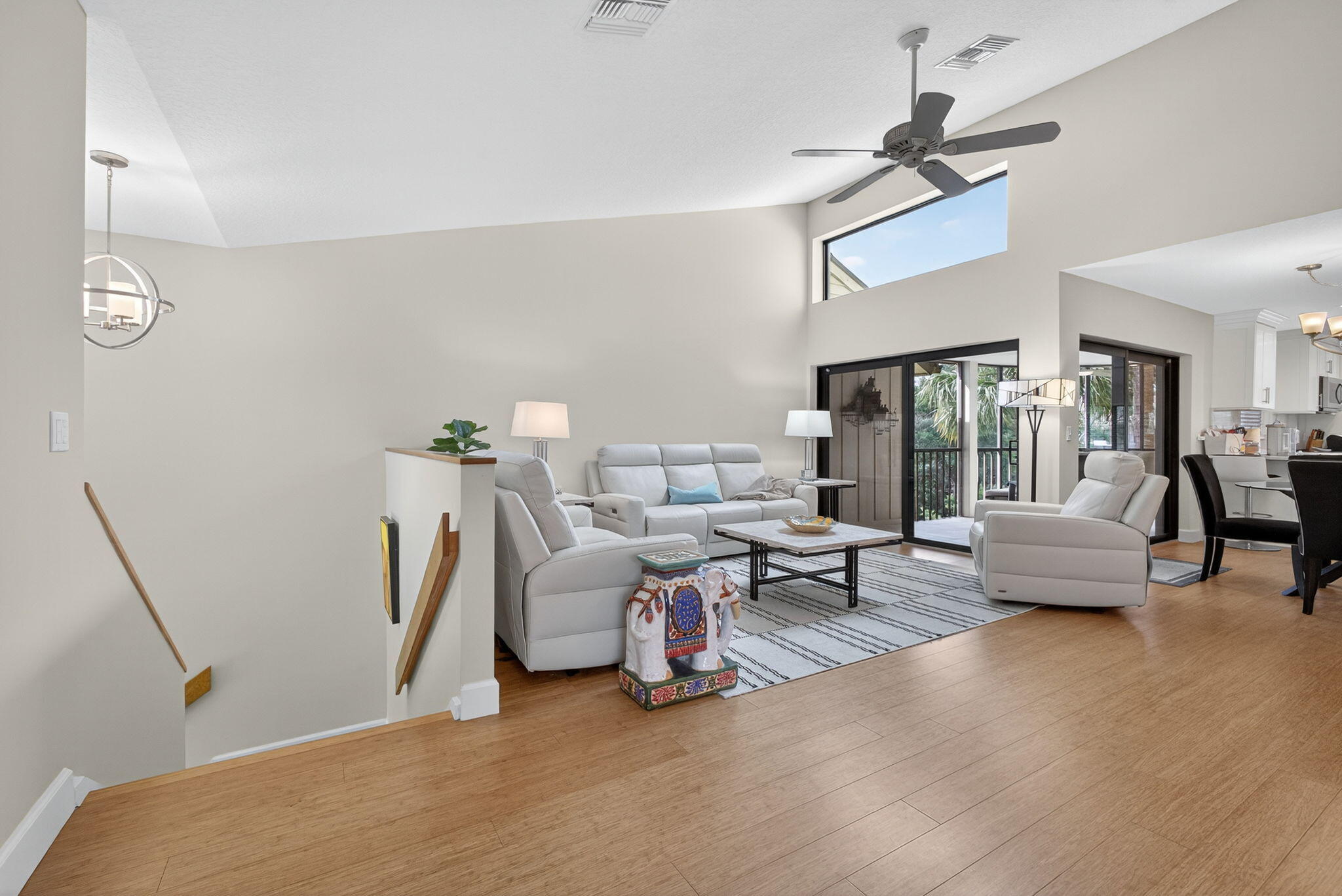 16941 Waterbend Drive, Unit 252 Jupiter, FL 33477 - Photo 5 of 34 a living room with furniture and a wooden floor