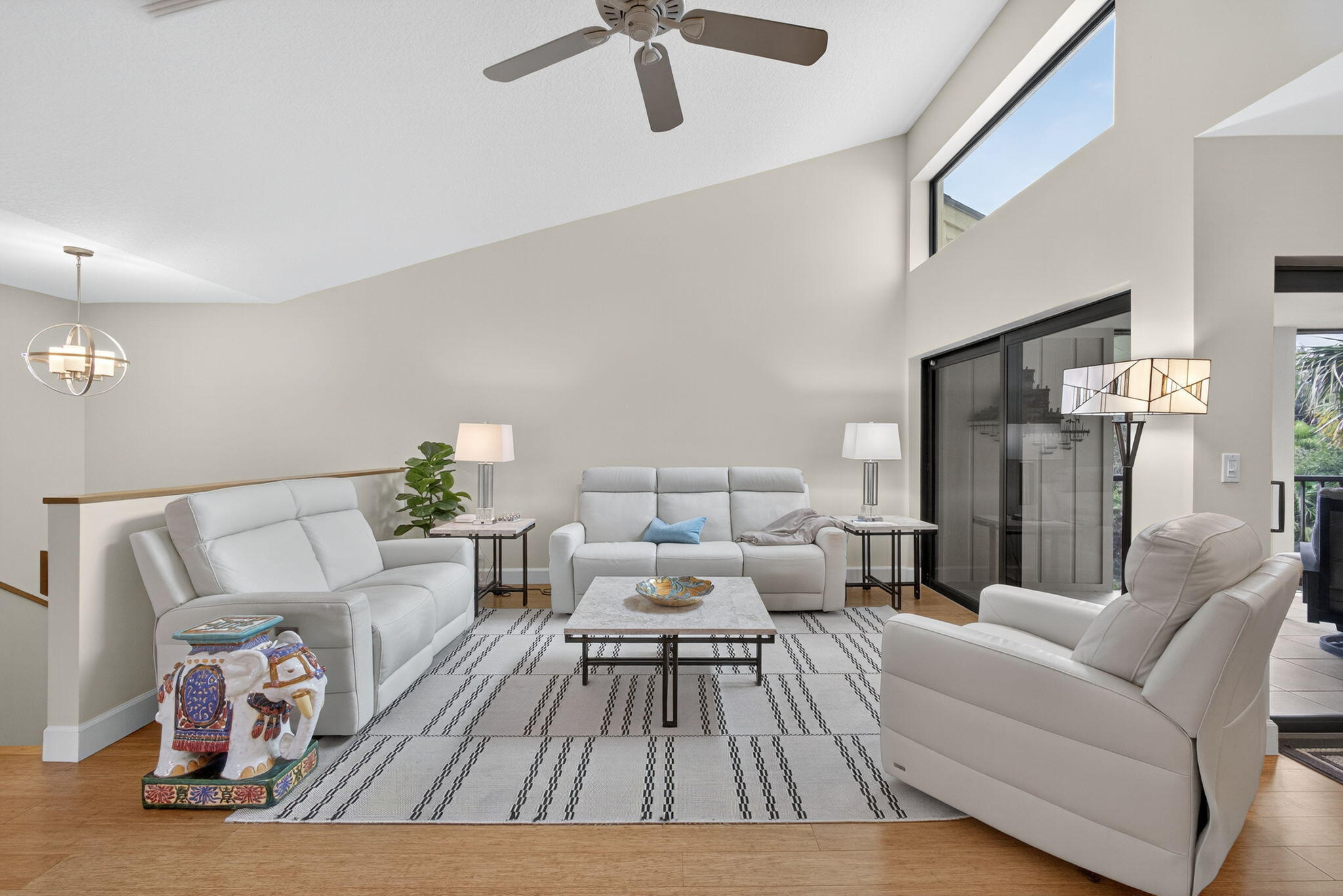 16941 Waterbend Drive, Unit 252 Jupiter, FL 33477 - Photo 7 of 34 a living room with furniture and a wooden floor