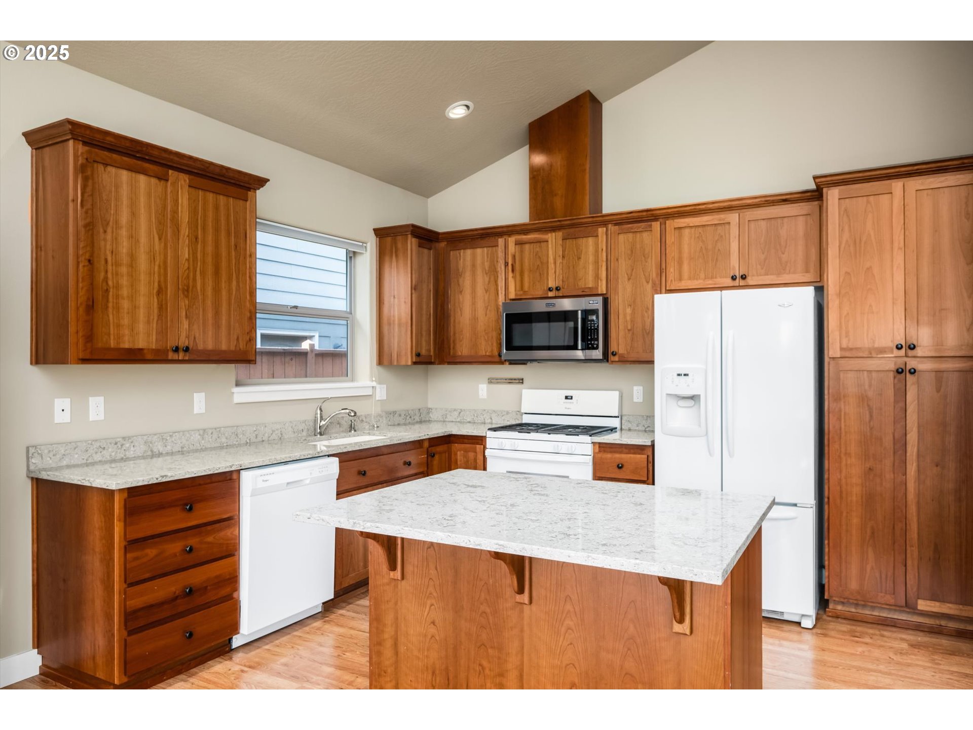 3768 Pachysandra Place Eugene, OR 97402 - Photo 14 of 41 a kitchen with stainless steel appliances a stove a refrigerator a sink and dishwasher