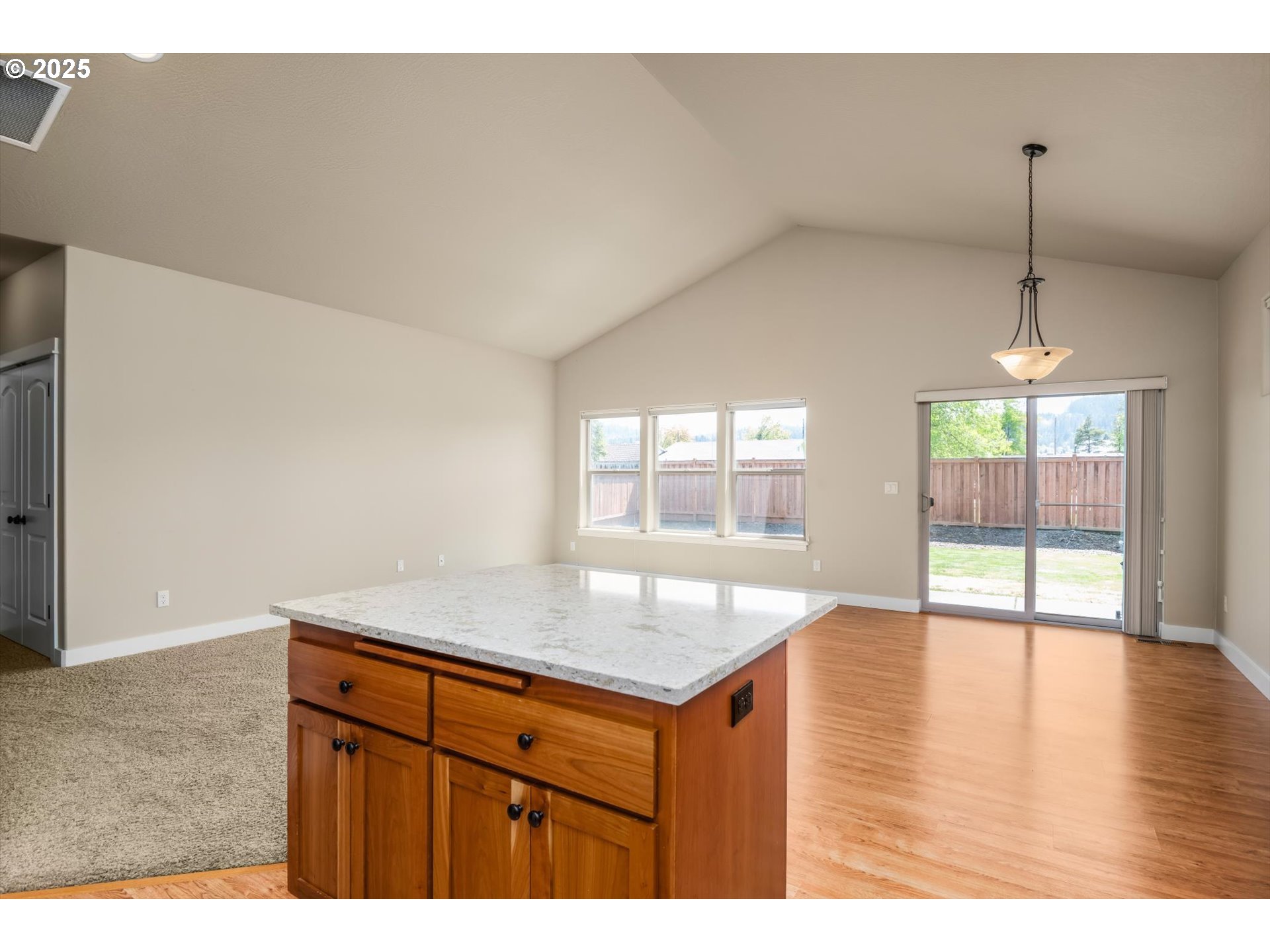 3768 Pachysandra Place Eugene, OR 97402 - Photo 17 of 41 a kitchen with granite countertop a sink window and wooden floor