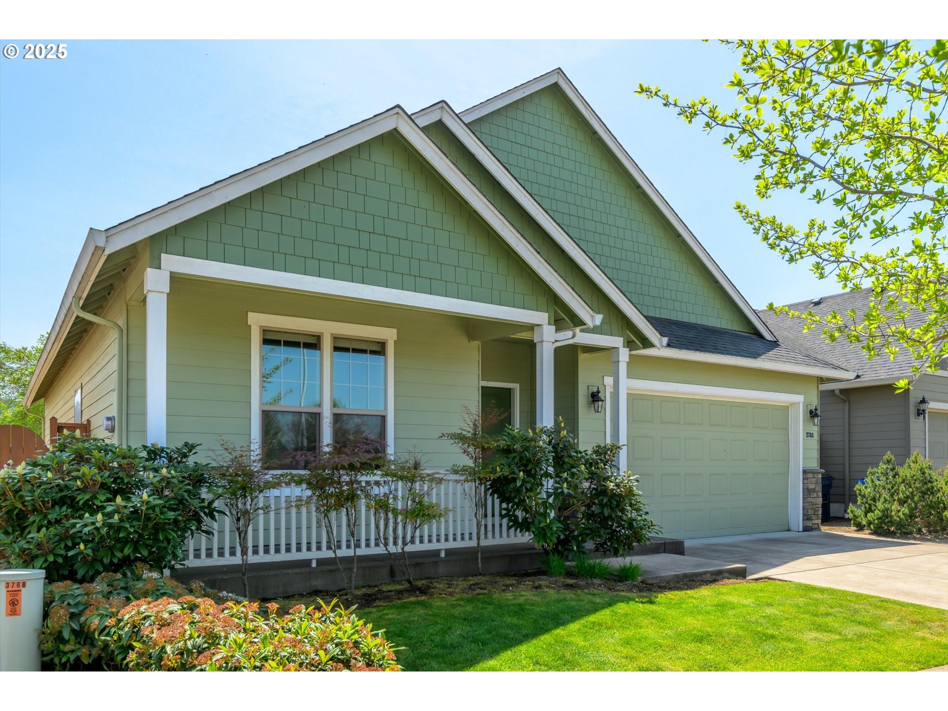 3768 Pachysandra Place Eugene, OR 97402 - Photo 2 of 41 a front view of a house with a garden