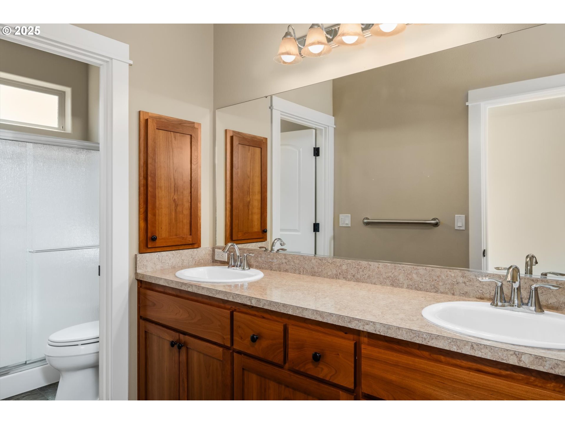 3768 Pachysandra Place Eugene, OR 97402 - Photo 23 of 41 a bathroom with a granite countertop sink a toilet and a mirror