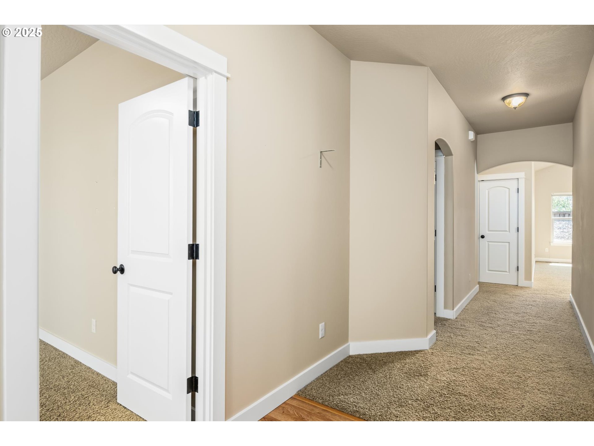 3768 Pachysandra Place Eugene, OR 97402 - Photo 6 of 41 a view of a hallway with wooden floor