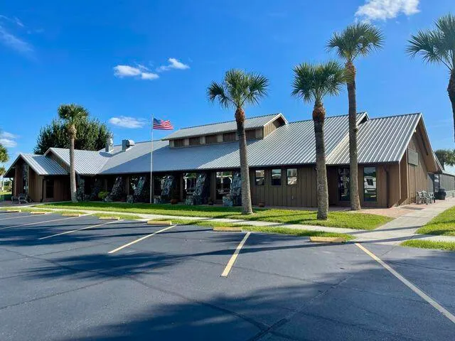 a swimming pool with outdoor seating and yard