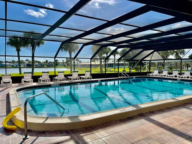 a view of a swimming pool with a patio