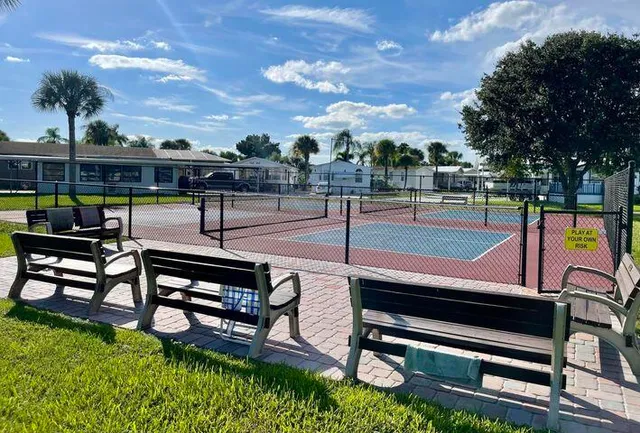 a view of a outdoor sitting area with furniture