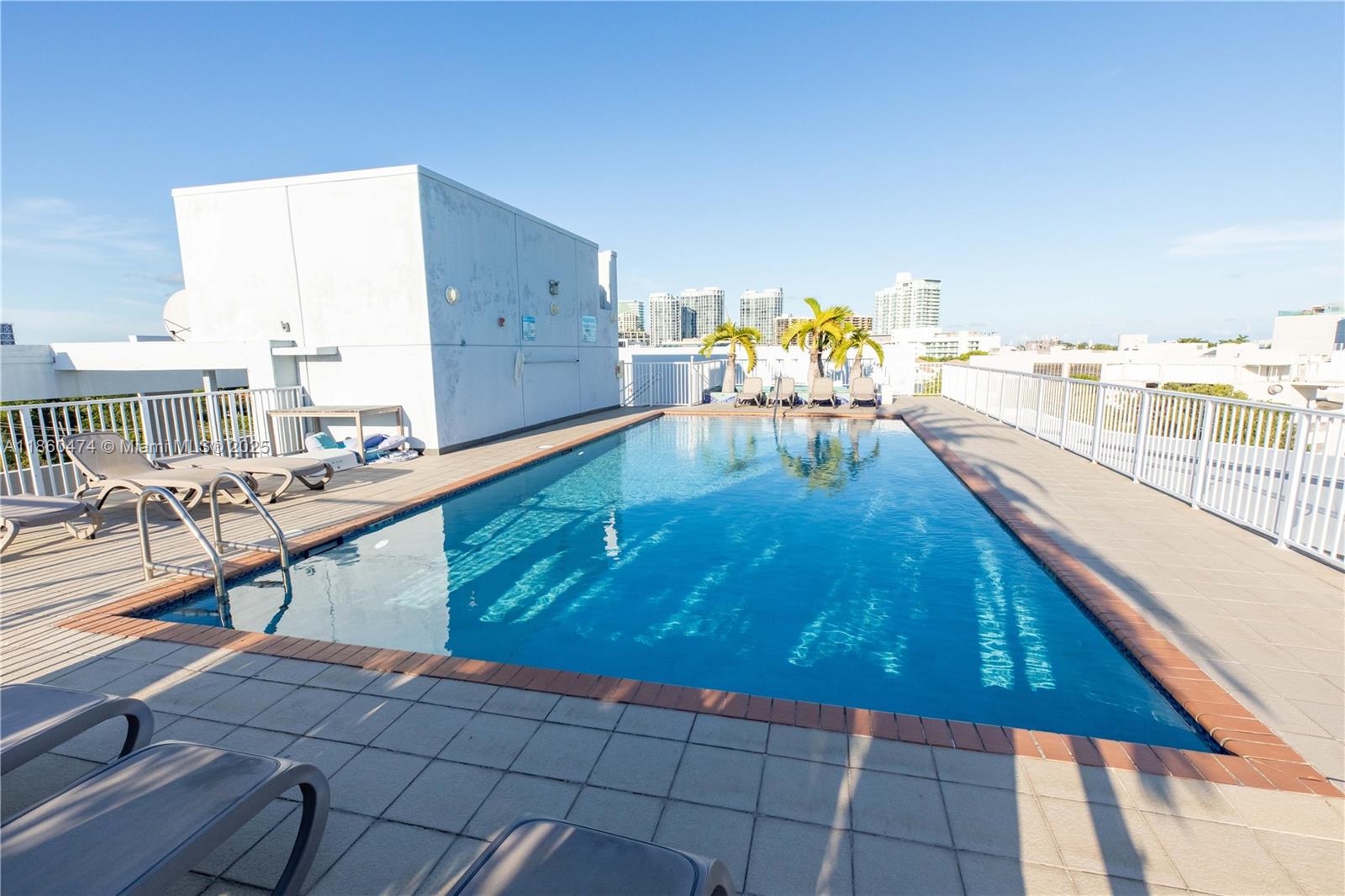 3250 Grand Avenue, Unit 404 Miami, FL 33133 - Photo 13 of 17 a view of a balcony with chairs