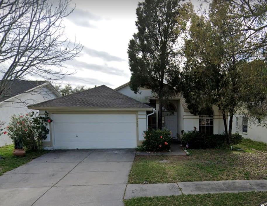 1555 Chepacket Street Brandon, FL 33511 - Photo 1 of 1 a view of house and garden