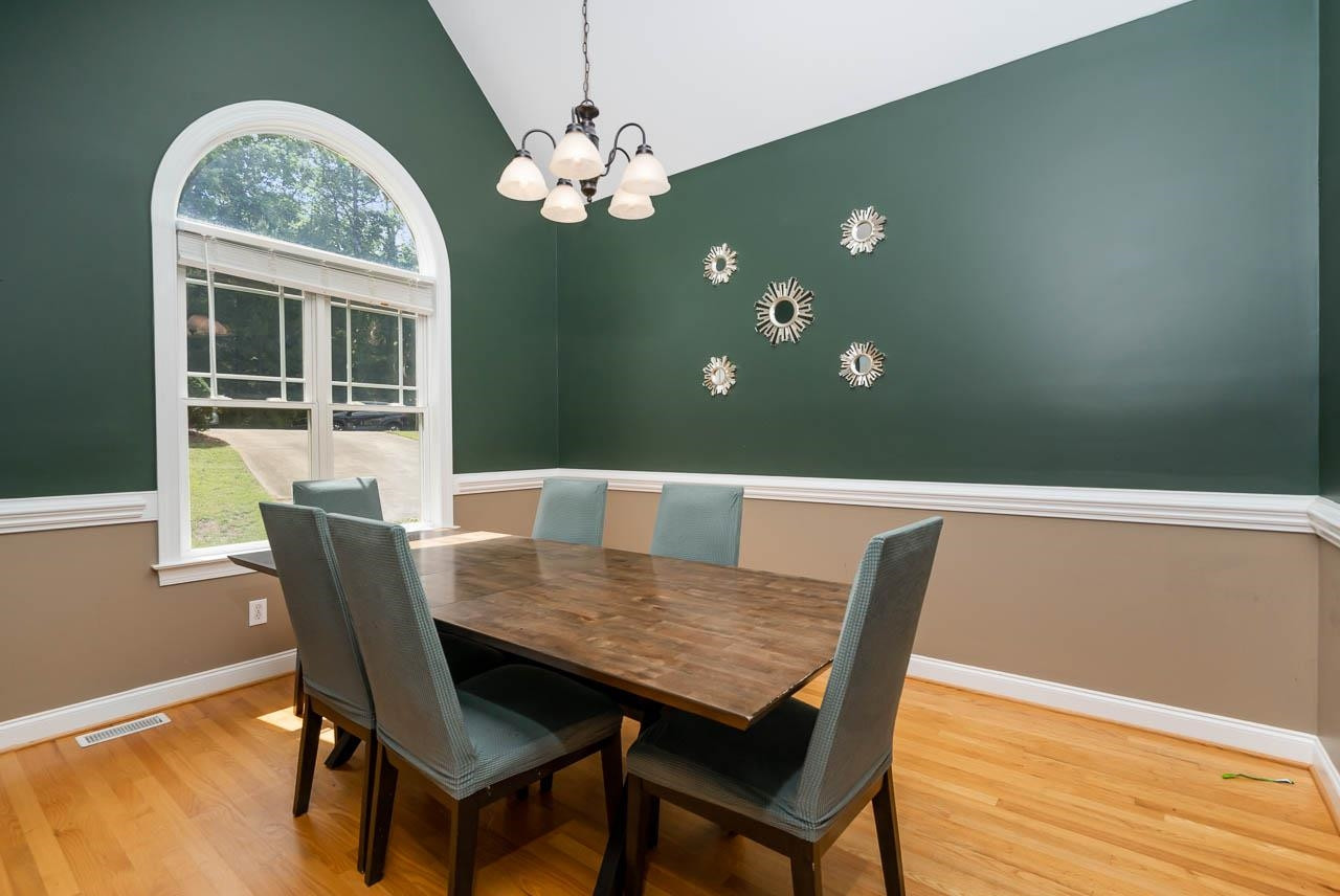1309 Taylor Farm Road Raleigh, NC 27603 - Photo 10 of 38 Palladian window, hardwood floors, vaulted ceiling, chair rail molding Dining Room