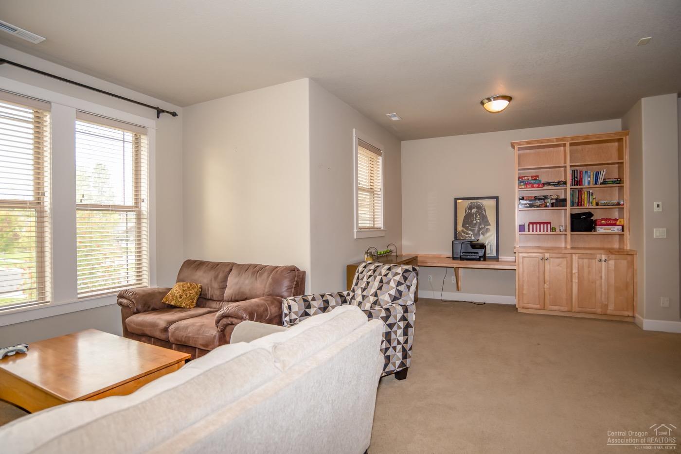 61118 Aspen Rim Lane Bend, OR 97702 - Photo 17 of 25 Upstairs bonus room with builtin desk ar