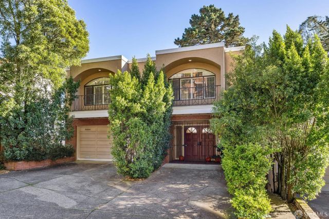 front view of a house with a trees