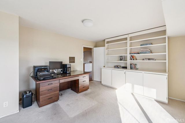 a kitchen with stainless steel appliances a stove and more cabinets