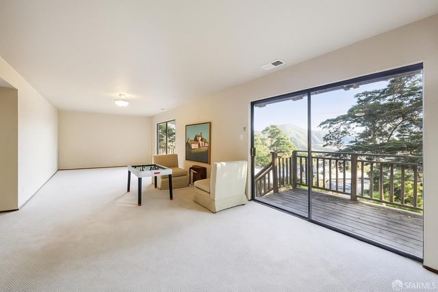 a view of livingroom with furniture and floor to ceiling window
