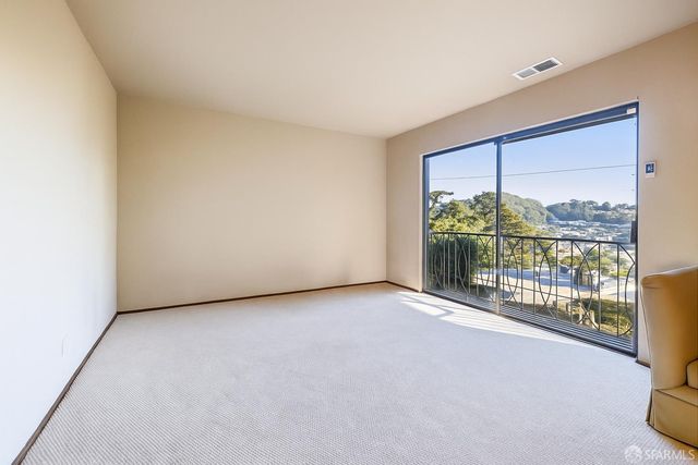 a view of a room with large windows