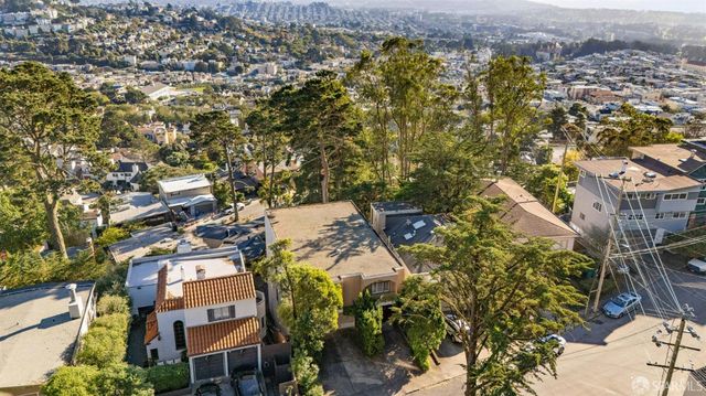 an aerial view of residential house with parking space